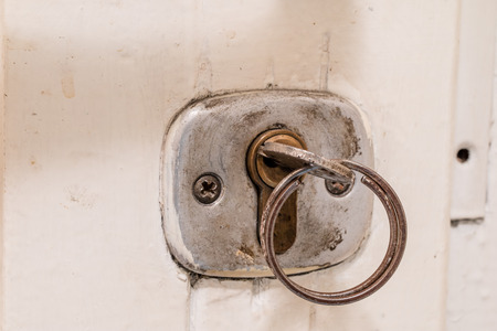 Keys to the front door of the house. Various accessories needed to protect your home from theft. Light background.の写真素材