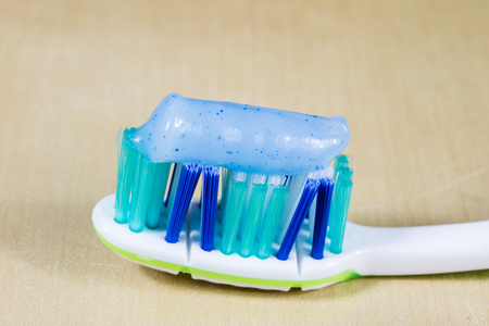 A new toothbrush. Toothpaste arranged on the bristles of a toothbrush for brushing and brushing...