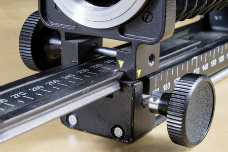 Old intermediate bellows for high-magnification photography. Photo accessories for old cameras. Dark...