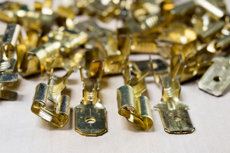 New electrical connectors. Accessories for electrical installations on a wooden workshop table. Light background.の写真素材