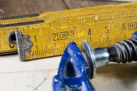 Carpenter's clamp for carpentry work. Accessories in a carpentry workshop for furniture...