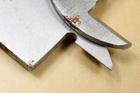 Measuring tools in the workshop. Caliper for locksmith work on a wooden table. Dark background.の写真素材