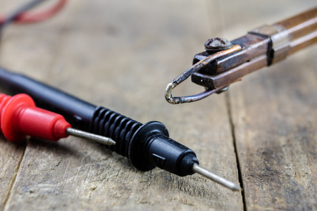 Accessories in the electronics workshop. Soldering iron, tin and other tools needed for repairs of...