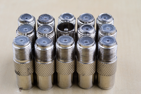 F-type connector in the enlargement. Accessories used for the installation of cable television. Light background.の写真素材