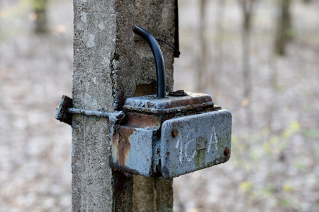 Old box used for electrical installations. Space for wires and electric fuses. Season of the spring.の写真素材