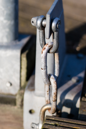 Steel construction used at bridges. Szekla and the chain maintaining the gangway in the marina. Season of the spring.の写真素材