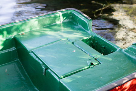 A fishing boat moored to the shore of the lake. Old fishermen's boat prepared for fishing on lakes. Season of the spring.の写真素材