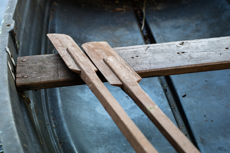Paddles of fishing boats. Old fishing accessories in fishing boats. Season of the spring.