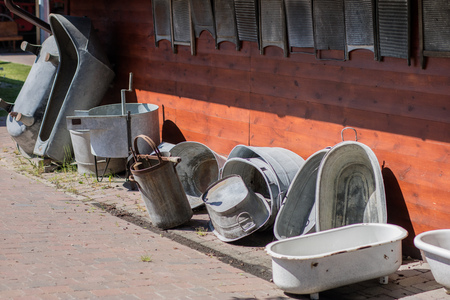 Old bath tubs and hygiene. Devices that facilitate housework in an old house. Season of the spring.