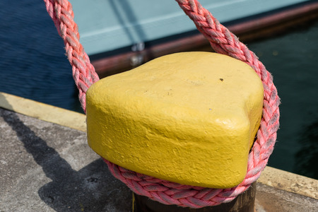 Harbor bollard for large naval vessels. The port wharf in central europe. Season of the summer.の写真素材