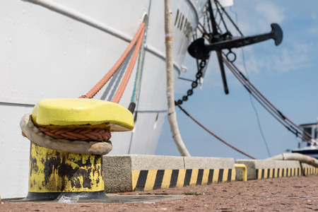 Harbor bollard for large naval vessels. The port wharf in central europe. Season of the summer.の写真素材