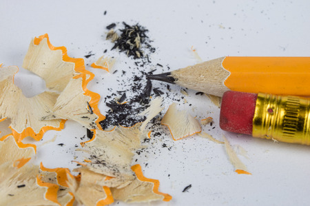 Pencil and sharpener on a white table. Accessories for drawing and sketching. White background.