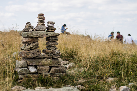 Stones stacked on top of a mountain. The summit in central europe. Season of the summer.の写真素材