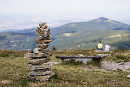 Stones stacked on top of a mountain. The summit in central europe. Season of the summer.の写真素材