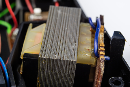 Old integrated circuits in an analog radio receiver. Resistors, transistors and other circuits on an...