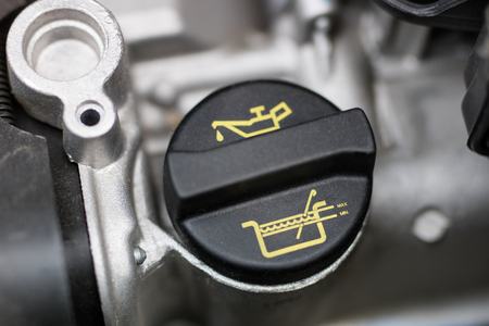 Car dipstick for oil level measurements. Checking the parameters of the car engine. Place - workshop.の写真素材