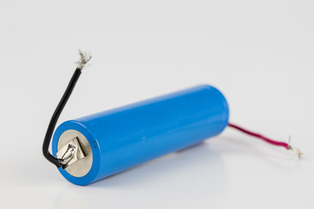 Battery for use inside the electronic device. Battery for a small screwdriver. Light background.の写真素材