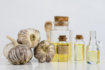 Garlic and syrup the best medicine for colds. The best home remedies for flu treatment. Light background.の写真素材