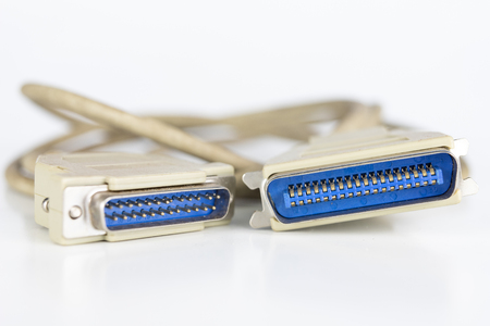 Old PC cables on a white table .. Com and lpt connectors for old computer stations. White...