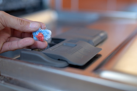 Place for a powder or tablet in a kitchen dishwasher. Kitchen appliances helpful in home-made...