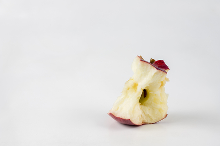 Tasty and ripe apple on the kitchen table. Sweet fruits from central europe. White background.の写真素材