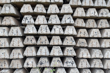 Reinforced concrete sleepers intended for the railway industry. Materials prepared for the construction of the railway line. Season of the autumn.の写真素材