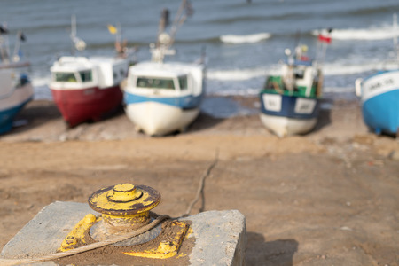 Winch for fishing boats on the Baltic Sea. Fishing port on the coast in central europe. Season of...