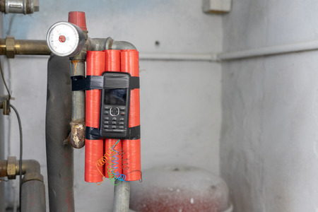 Dynamite sticks with time igniter. Explosive material with ignition connected to a mobile phone....