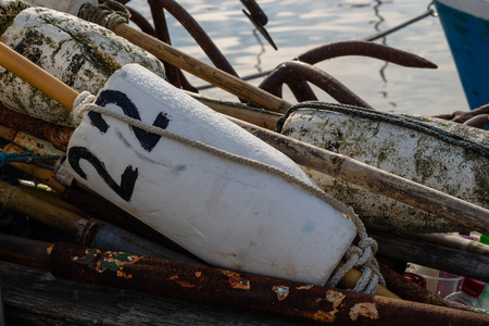 Anchor used for anchoring fishing nets. Fishing accessories in the port of central europe. autumn season.qの写真素材