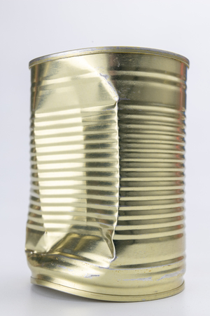 Can with meat dish on a white table. Canned food with a long shelf life. Light background.の写真素材