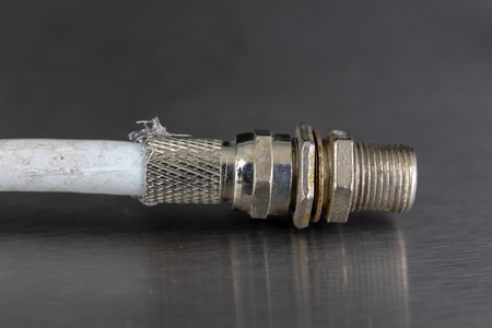 Antenna and television connectors on a metal table. Accessories for installing cable television....