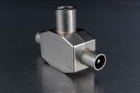 Antenna and television connectors on a metal table. Accessories for installing cable television....