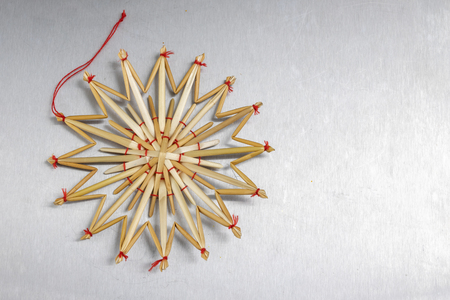 Christmas decorations on the kitchen table. Wooden Christmas figurines prepared for decorating a tree. Dark background.の写真素材