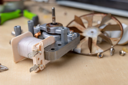 Spare parts for the repair of a household oven. A split stove for baking dishes. Light background.の写真素材