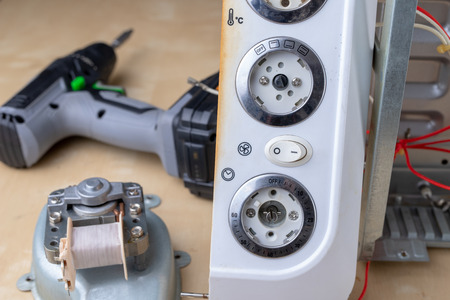 Spare parts for the repair of a household oven. A split stove for baking dishes. Light background.の写真素材