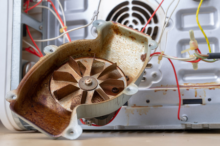 Spare parts for the repair of a household oven. A split stove for baking dishes. Light background.の写真素材