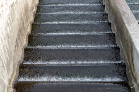 A small dam on a small river. Water dam in central europe. Season winter.の写真素材