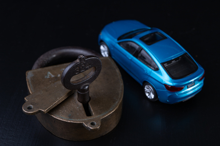 Securing the car against theft. Protection against theft of a passenger car. Dark background.の写真素材