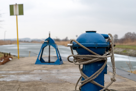 A small lock on a small channel. Old hydrotechnical construction. Season winter.の写真素材