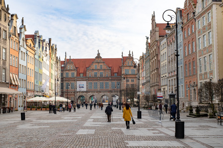 Gdansk, Pomeranian / Poland - February, 07, 2019: Walking people on the market near Neptune. Market...