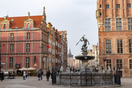 Gdansk, Pomeranian / Poland - February, 07, 2019: Walking people on the market near Neptune. Market...