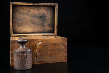 Old rusty metal weights for weighing products. Accessories for weight determination. Dark background.の写真素材
