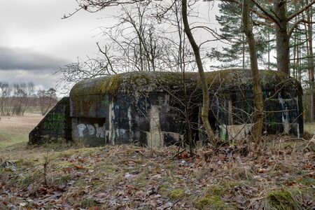 Grudziadz, kujawskopomorskie / Poland - March, 15, 2019: Polish fortifications from the World War II on the Osa River. Old bunkers made of reinforced concrete. Season of the spring.のeditorial素材