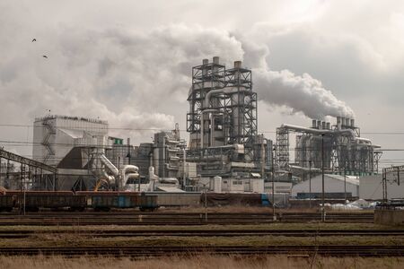 Szczecinek, zachodniopomorskie / Poland - March, 21, 2019: A modern wood processing plant. Smoking chimneys in a factory in Szczecinek. Season of the spring.のeditorial素材