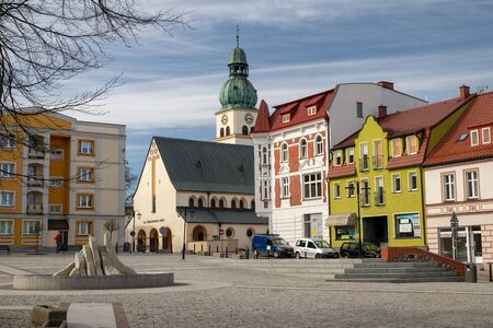 Czluchow, pomorskie / Poland - March, 31, 2019:  The market of a small town in Central Europe. Church and tenements in the city center. Season of the spring.のeditorial素材
