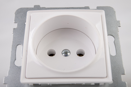 Unscrewed electrical socket. Accessories and components for the electrician needed for assembly in a...