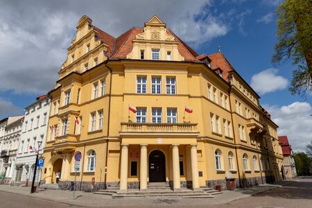 Bialogard, zachodniopomorskie / Poland - May, 7, 2019: The market of a small town in Central Europe. Old tenement houses and buildings in the city. Spring of the year.のeditorial素材