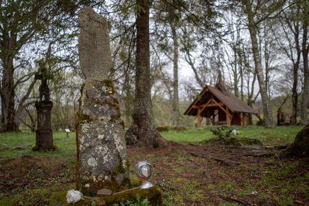 Wolosate, Malopolskie / Poland - April, 28, 2019: Old cemetery in a village in the mountains. Burial place in a small village. Season of the spring.のeditorial素材