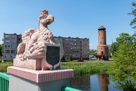 Gryfice, zachodniopomorskie / Poland - June, 5, 2019: Bridge over the river in a small town. The tower and old town walls on the river. Season of the spring.のeditorial素材