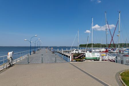 Kamien pomorski, zachodniopomorskie / Poland - June, 5, 2019: Marina in a small town in Pomerania. A small bridge and a wharf near the lagoon. Season of the spring.のeditorial素材